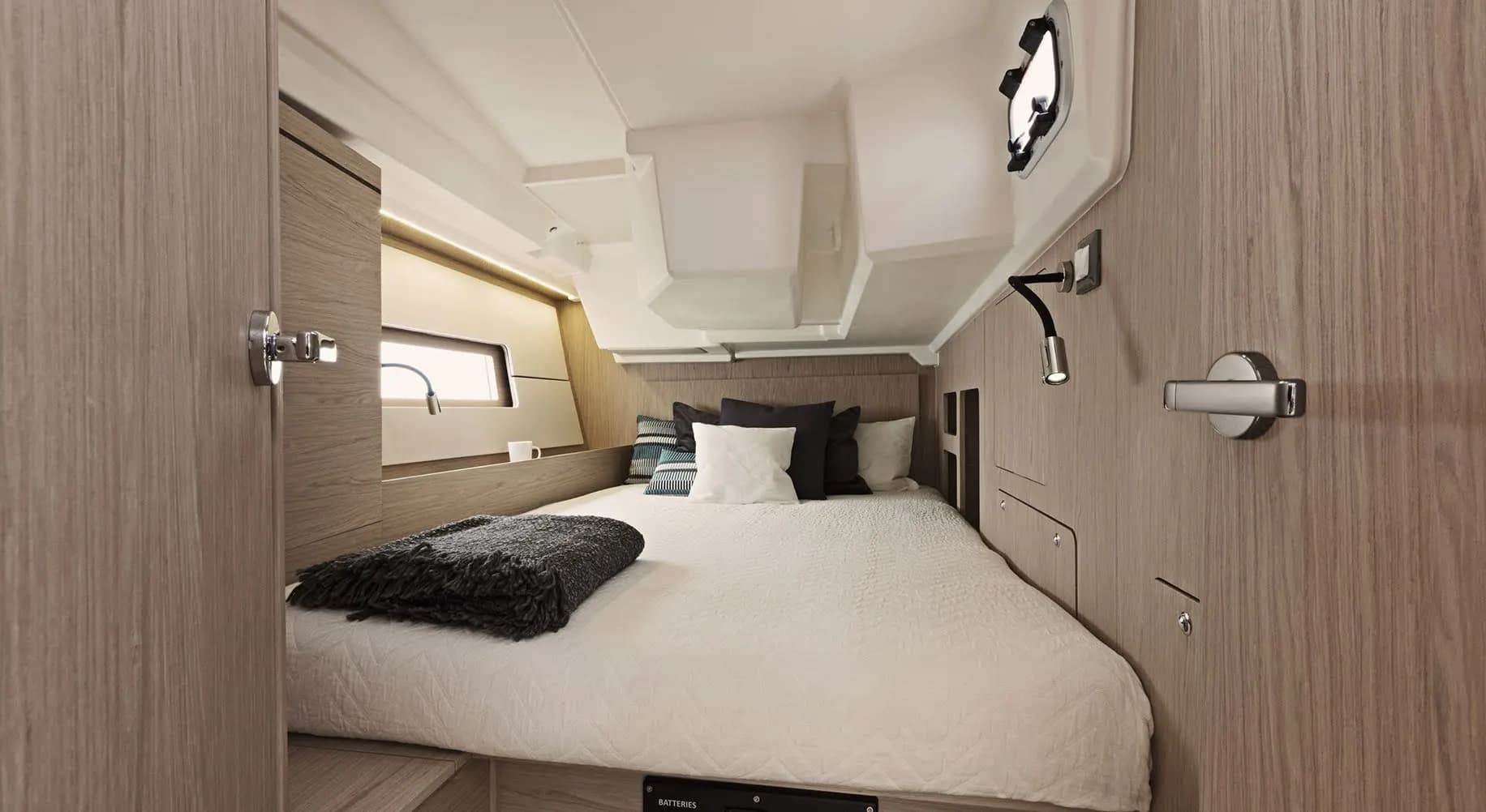 A double cabin with a made-up bed