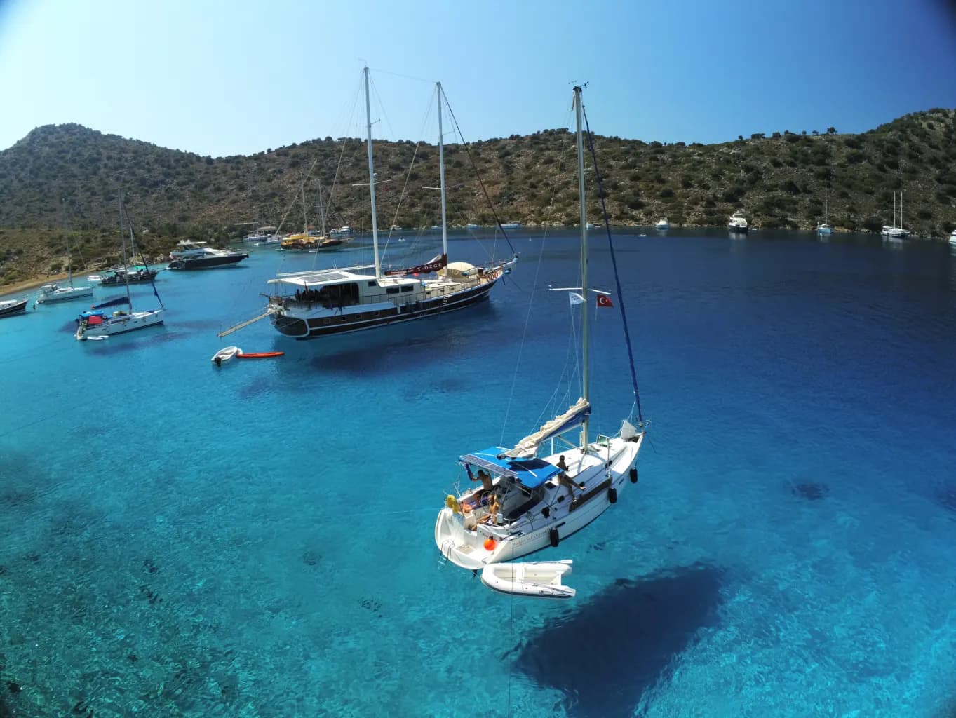 Gulets and yachts in aquarium-like turquoise waters