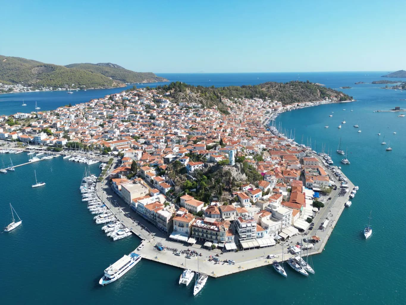 Aerial view of Poros town surrounded by sea