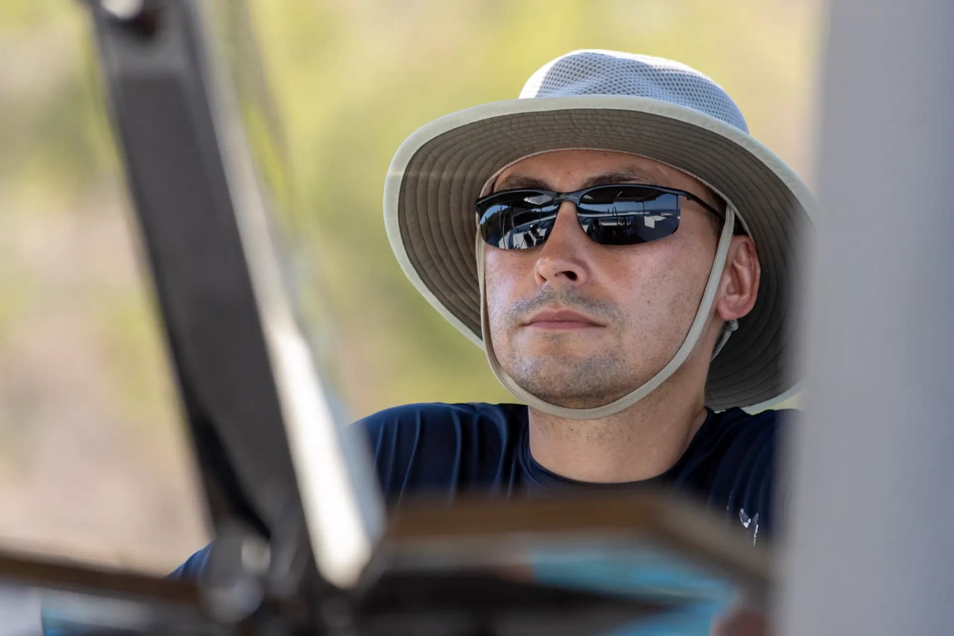 Alex, skipper and trip organizer, outdoors in a sun hat